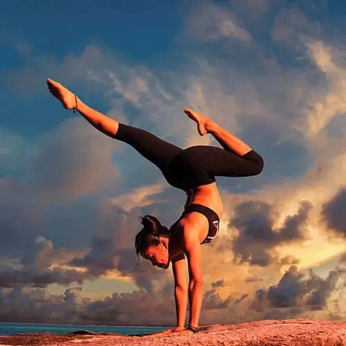 Woman doing a hand stand